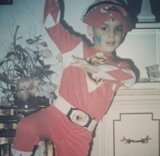 The photographer, aged about six, in a Red Ranger costume, mid-pose.